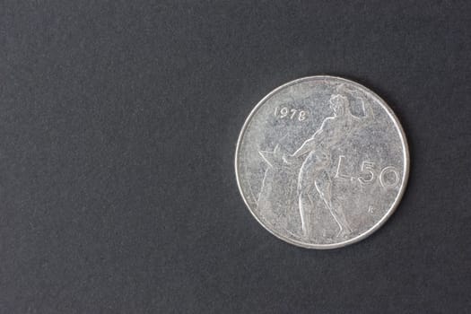 fifty Italian lire on a black background