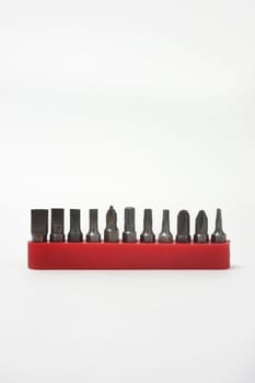 Front view of screwdriver bits in their plastic holders on white background