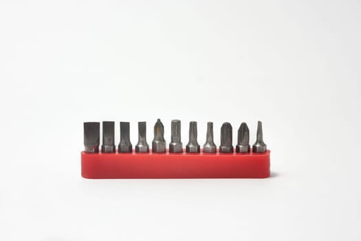 Front view of screwdriver bits in their plastic holders on white background