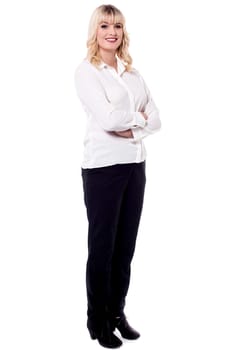 Experienced business lady posing with folded arms