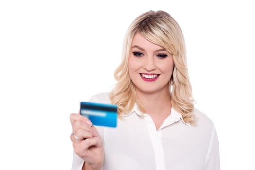 Smart lady looking at debit card