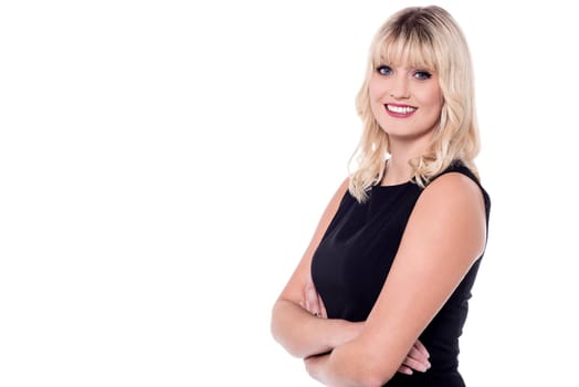 Pretty fashion woman posing with folded arms