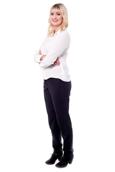 Confident smiling corporate woman, full length shot.