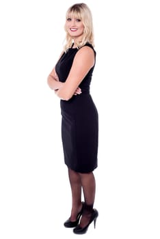 Full length pose of smiling charismatic lady