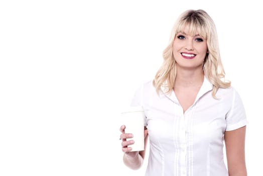 Smiling woman holding glass of beverage