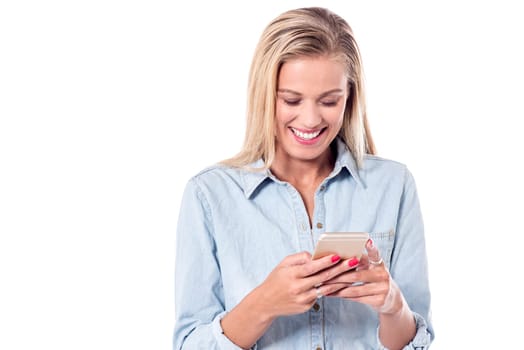 Delightful woman sending message to her friends
