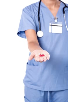 Female doctor giving medical pills