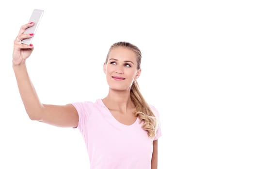 Pretty woman clicking a selfie with smartphone