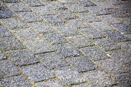 background texture from paver blocks of a road