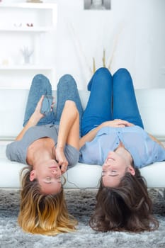 Two female friends sharing headphones