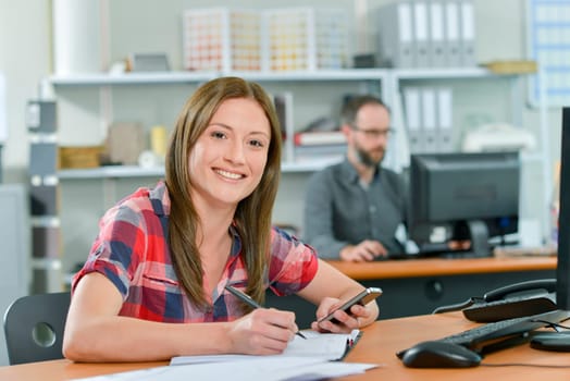 Office worker reading a text message