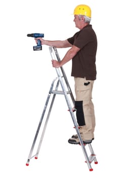 Labourer using a cordless screwdriver