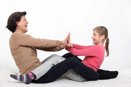 Mother playing with daughter