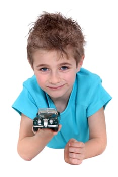 Little boy with toy car
