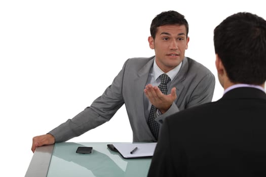 Two businessmen chatting