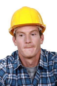 Construction worker biting his lips.