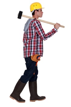 Young worker with a sledgehammer