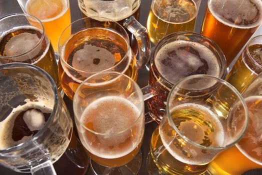 Many different beer glasses with different beer from all over the world
