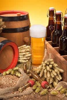 old beer carrier with beer glass,wheat,barley,hops and malt