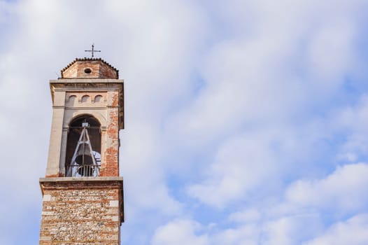 bell tower with a bell of a country church
