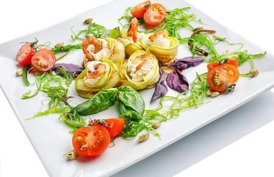 appetizing restaurant food - salad of greens, vegetables and shrimps on  white background