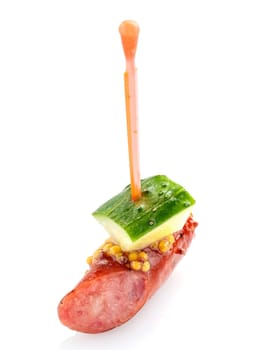 Delicious buffet,  with sausage and cucumber  on  white background