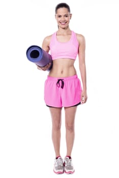 Fitness freak lady with exercise mat
