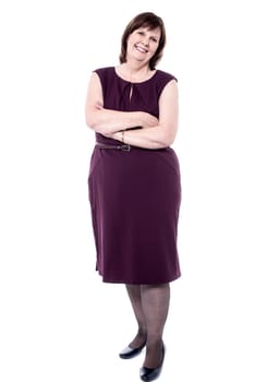 Senior woman in party wear with crossed arms