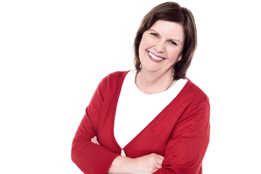 Happy senior woman posing with crossed arms