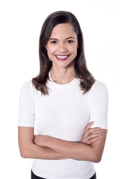 Pretty young woman posing with crossed arms
