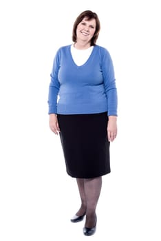Attractive senior woman standing in front of white background