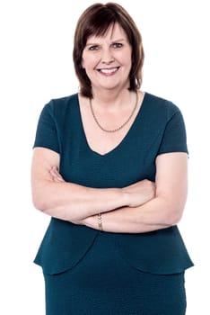 Elegant senior woman posing with folded arms
