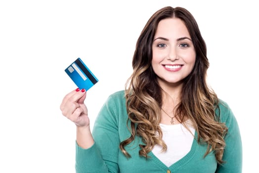 Cheerful woman showing her new credit card