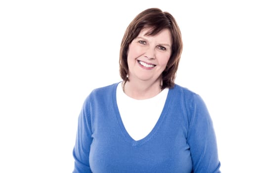 Smiling senior woman in front of white background