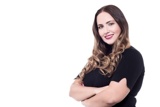 Confident woman dressed in casual wear with crossed arms