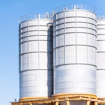 Detail of chemical plant, silos and pipes