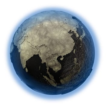 Southeast Asia on 3D model of planet Earth with black oily oceans and concrete continents with embossed countries. Concept of petroleum industry or global enviromental disaster. 3D illustration isolated on white background.