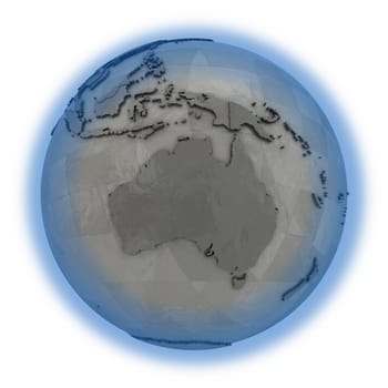 Australia on 3D model of metallic planet Earth made of steel plates with embossed countries. 3D illustration isolated on white background.