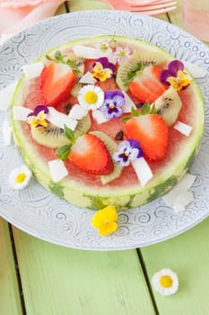 Fruit pizza from watermelon with fresh fruit with blueten