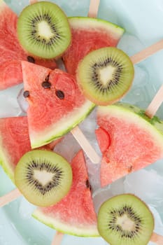 Colorful fruit on the stem on ice cream