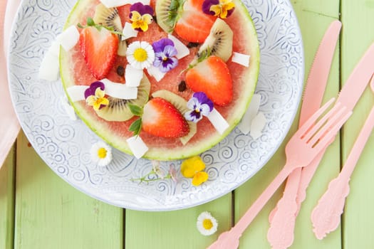 Fruit pizza from watermelon with fresh fruit with blueten