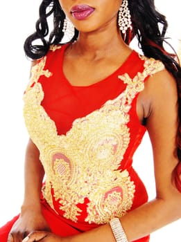 An African American woman standing in a red evening dress.with gold embroideries and long black hair isolated for white background..