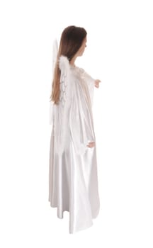 An angel in a long white satain dress with wings and long brown hair.standing in profile, isolated for white background..