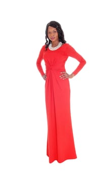 A lovely slim African American woman in a long red dress and curly .black hair standing from front, isolated for white background..