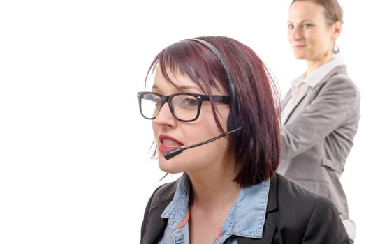 a close-up portrait of smiling young woman with headset