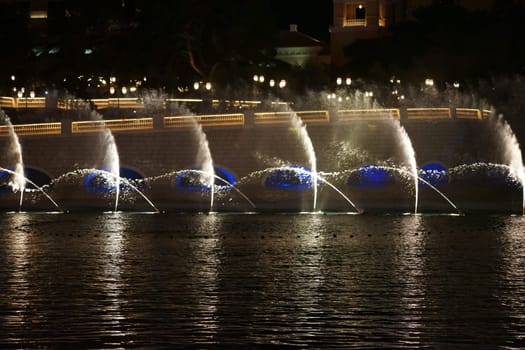 Las Vegas,United States - December 23,2015: The famous water show in front of the luxury Bellagio hotel with water fountains and colorful lighting on Las Vegas Boulevard on the night of December 23,2015 in Las Vegas.