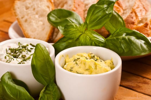White bread prepared with herb butter and herb quark