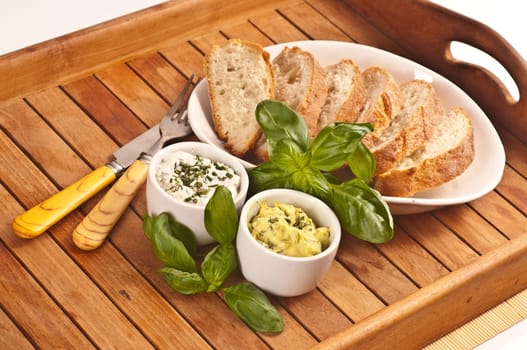 Fresh bread with herb butter and herb quark