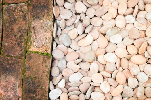 Pebble stones and bricks abstract background, stock photo