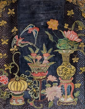 Ancient Thai mural art in Chinese style on temple wall of Wat Rajorasaram in Bangkok, Thailand